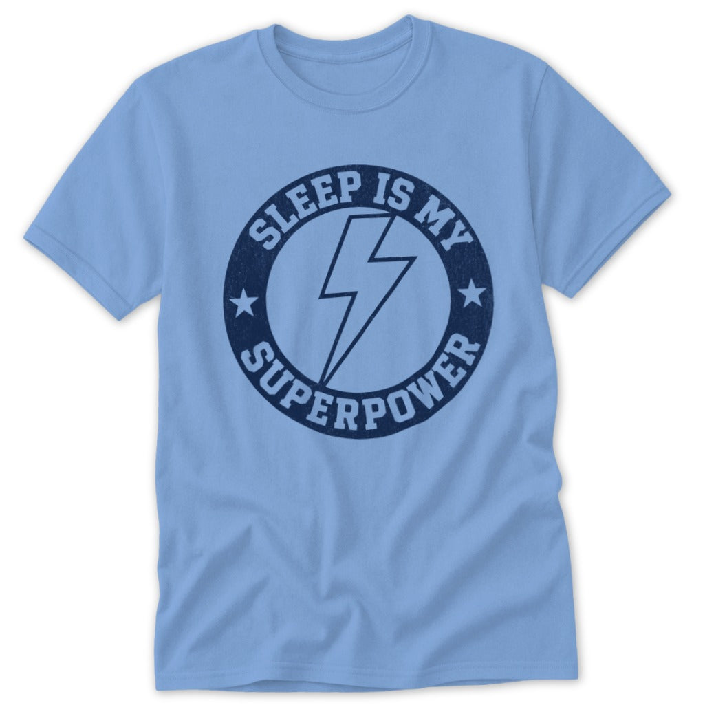 Light blue t-shirt with navy graphic reading "Sleep is my superpower" and lightning bolt.