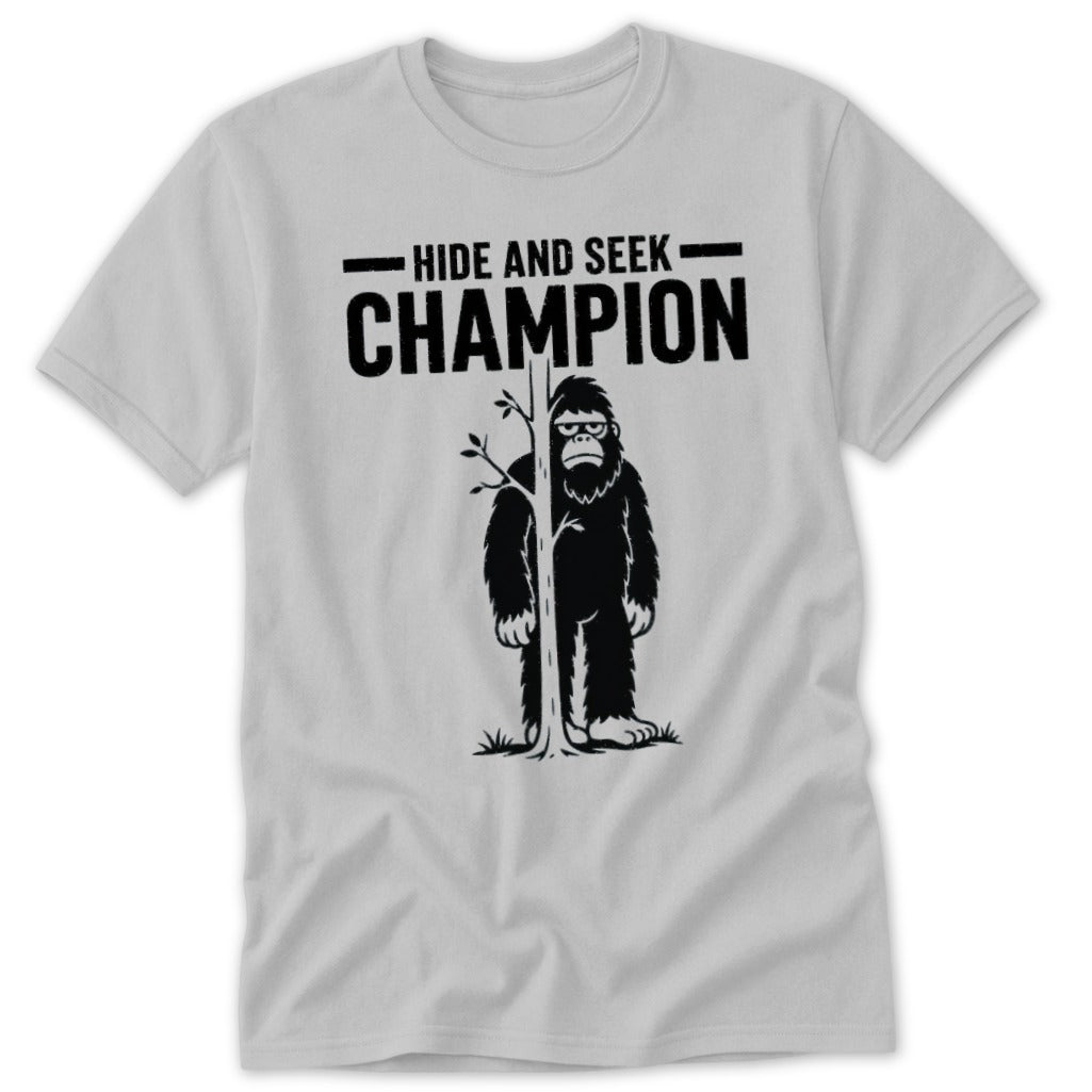 Bigfoot peeking from behind a tree with text "Hide and Seek Champion".