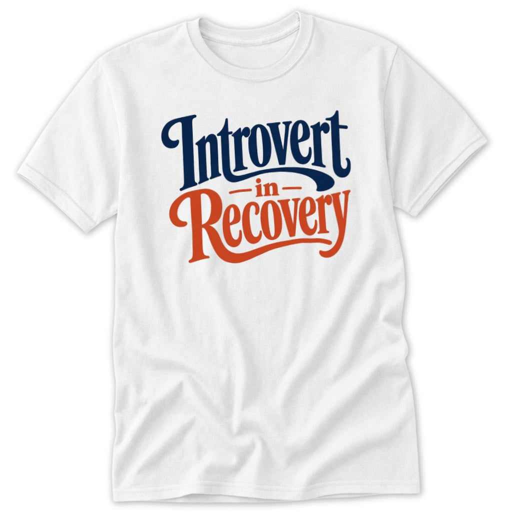 A white t-shirt featuring dark blue text that reads Introvert and orange text that reads Recovery.