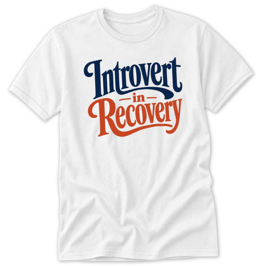 A white t-shirt featuring dark blue text that reads Introvert and orange text that reads Recovery.
