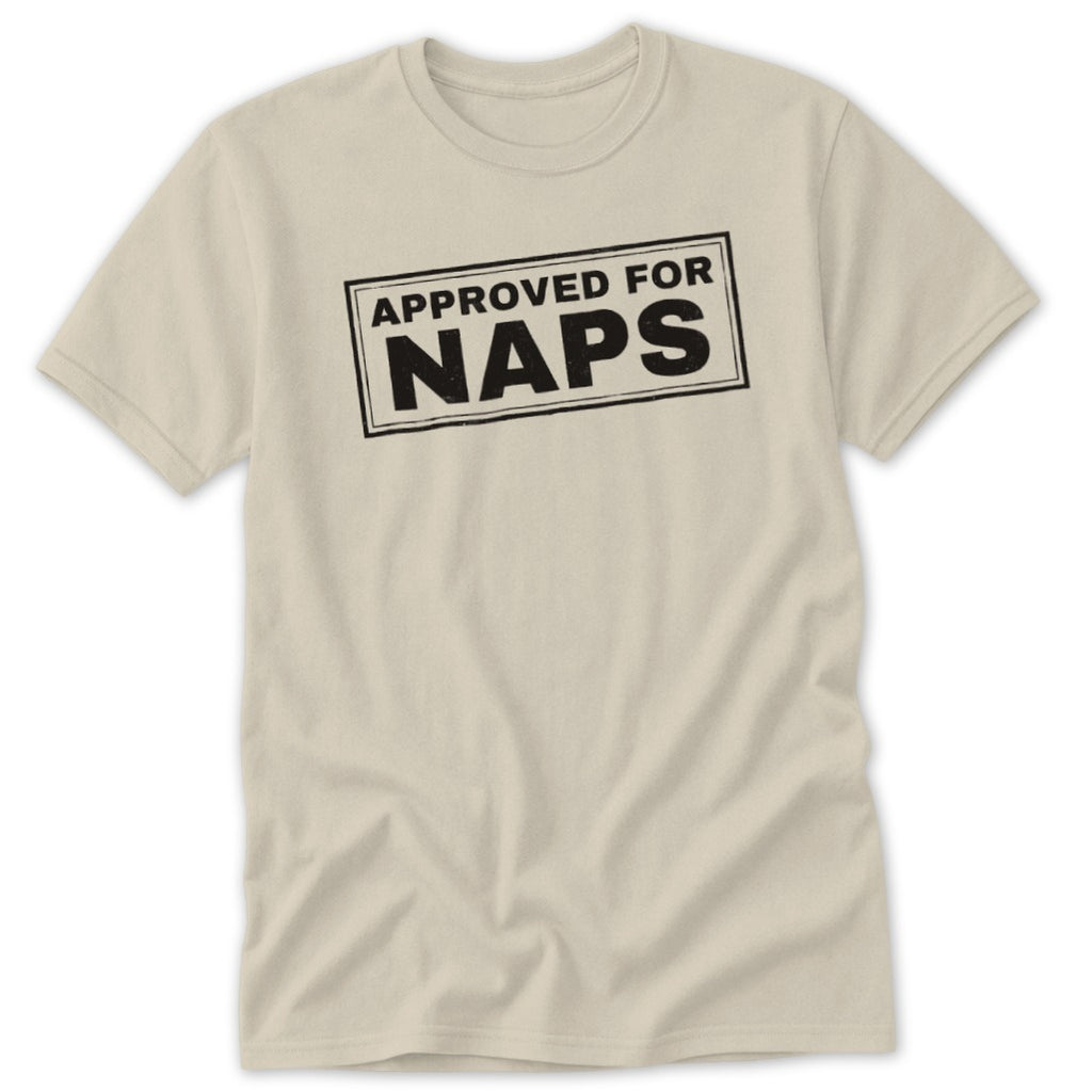 Light beige short-sleeve t-shirt with a rectangular black stamp graphic reading "APPROVED FOR NAPS" on the chest.
