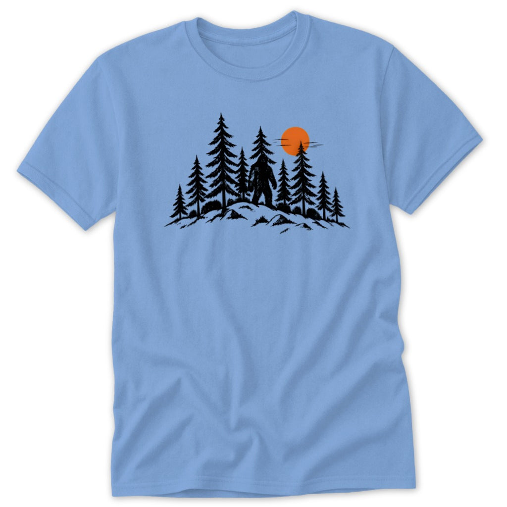 Bigfoot silhouette in forest with orange sun at sunset.