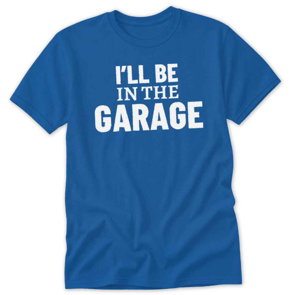 Royal blue t-shirt with white text "I'LL BE IN THE GARAGE".