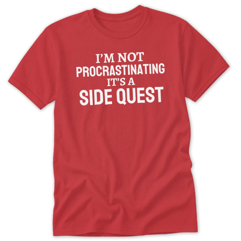 Red t-shirt with white text reading "I'M NOT PROCRASTINATING IT'S A SIDE QUEST".