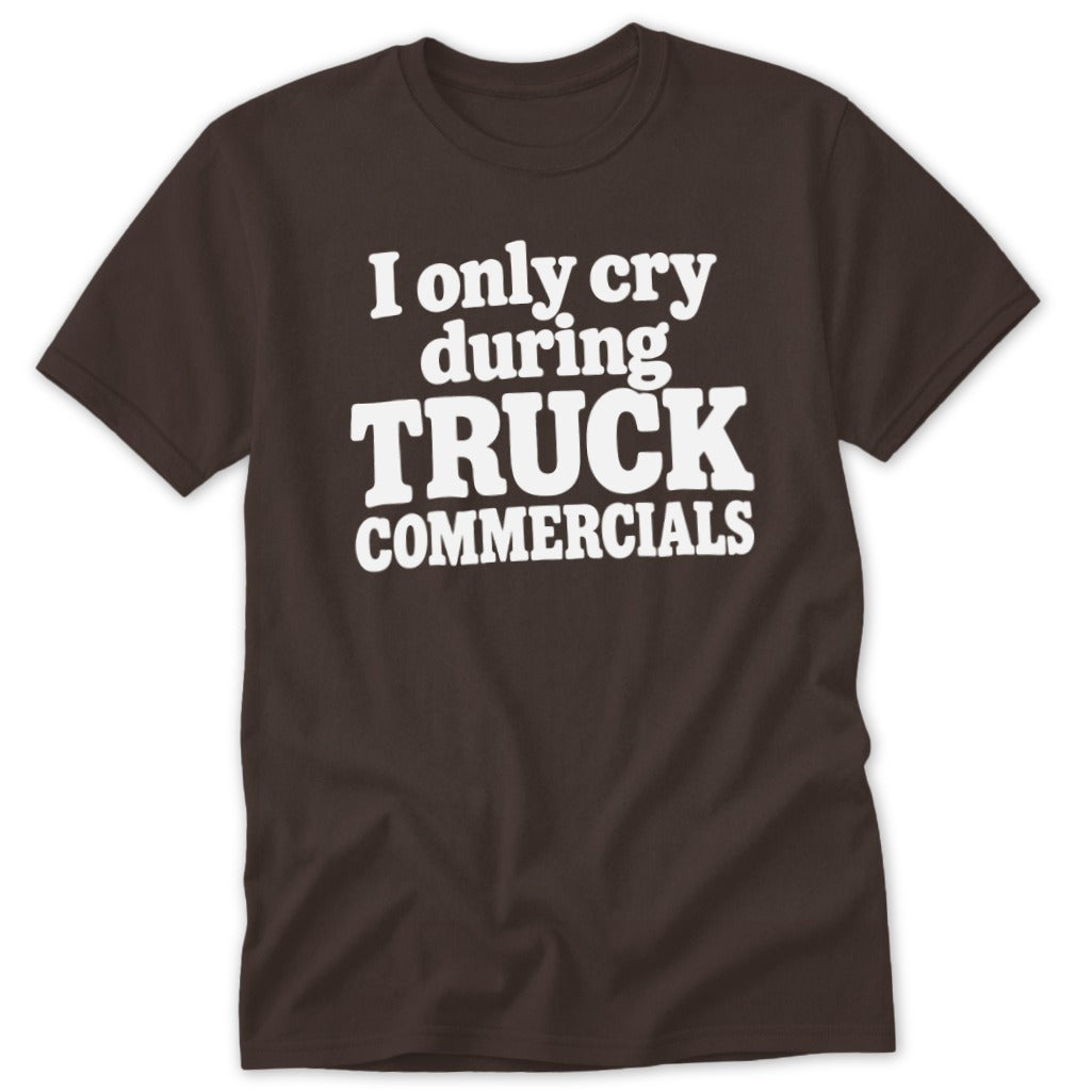 A brown short-sleeved crewneck t-shirt featuring the white text "I only cry during TRUCK COMMERCIALS" printed centrally on the chest.