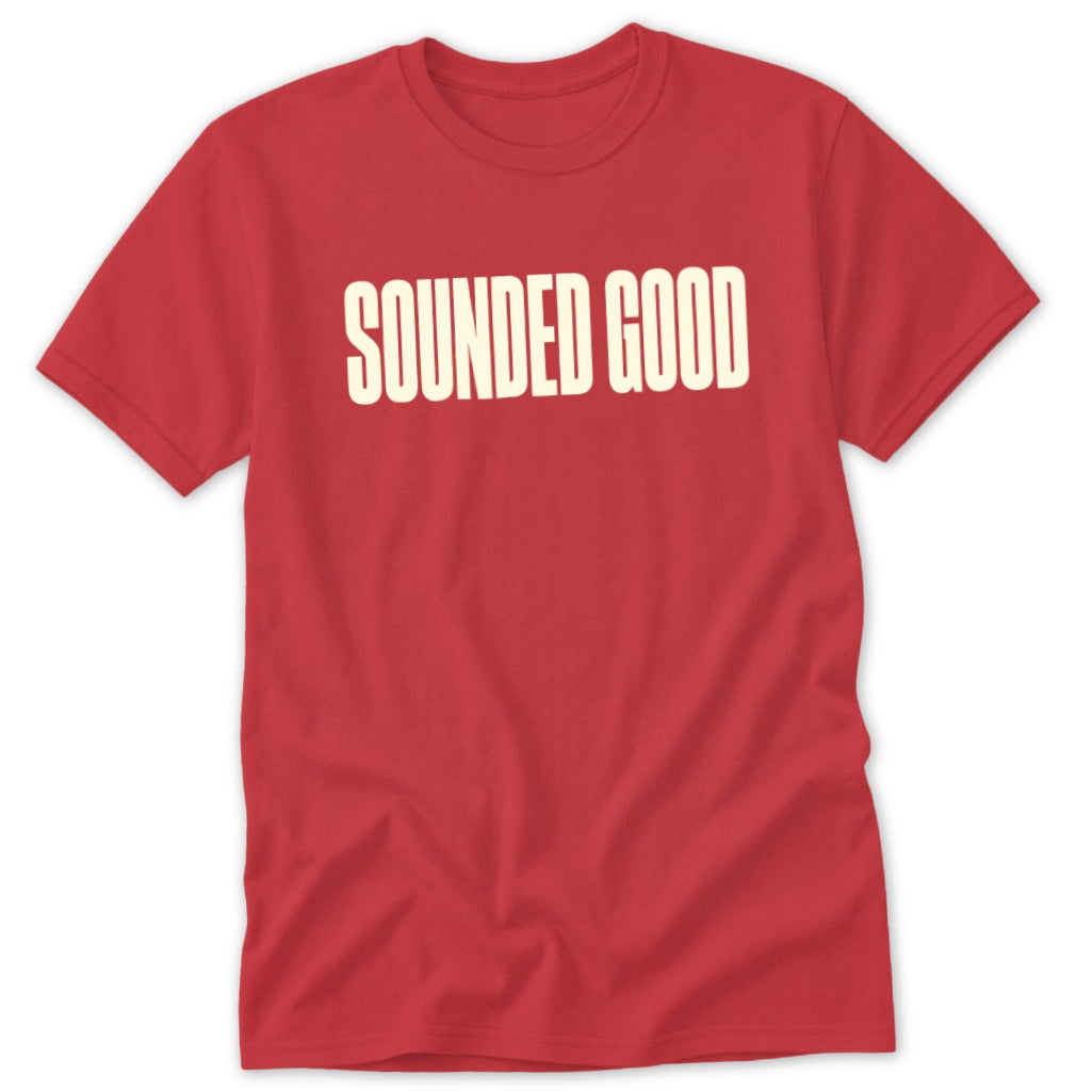 Red t-shirt with "SOUNDED GOOD" text in cream.