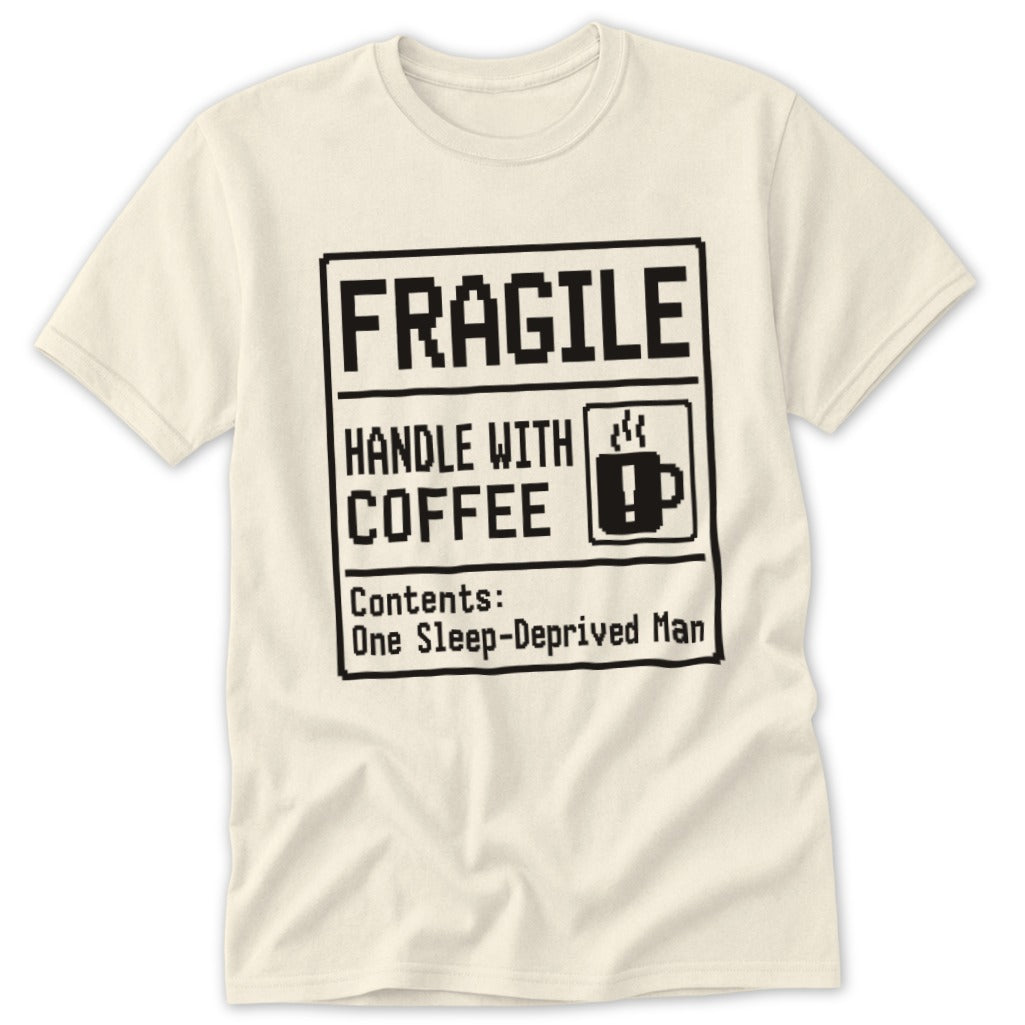 Cream t-shirt with "Fragile Handle With Coffee Contents: One Sleep-Deprived Man" text.