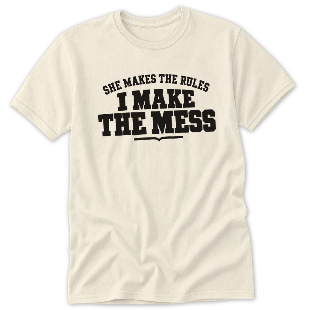 Cream t-shirt with black text reading "She Makes The Rules I Make The Mess".