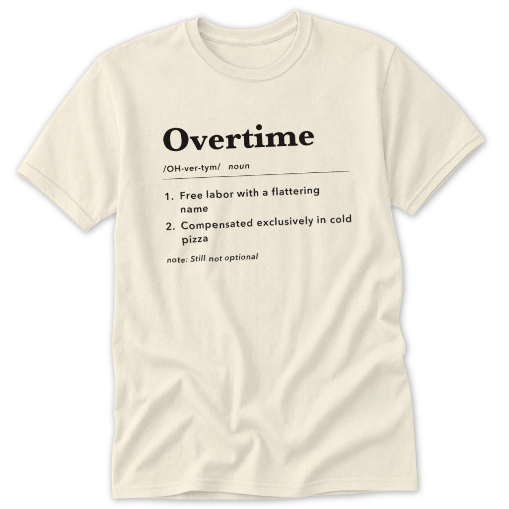 Cream t-shirt with "Overtime" definition: free labor, cold pizza, still not optional.