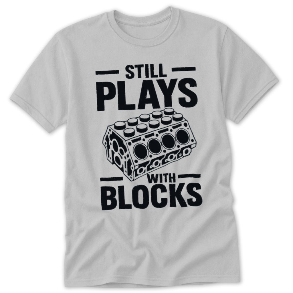 Light grey t-shirt with "Still Plays With Blocks" text and engine block graphic.