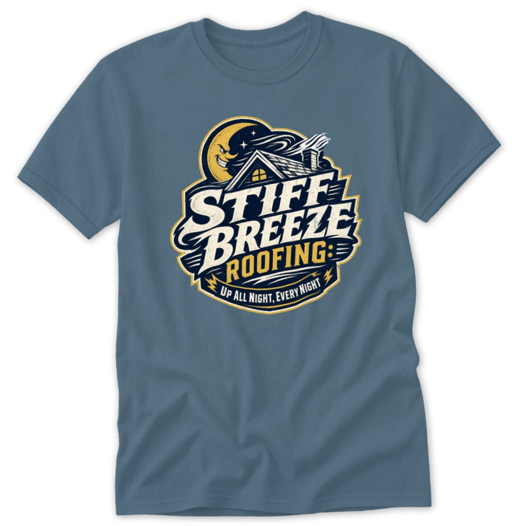 A slate blue t-shirt featuring a stylized graphic with a smiling crescent moon, house, and text reading Stiff Breeze Roofing.