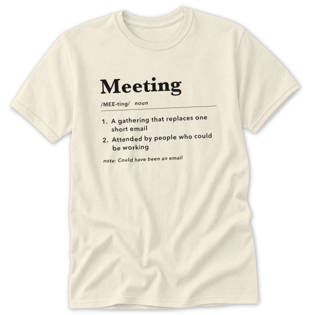 Cream t-shirt with black text defining "Meeting" humorously.