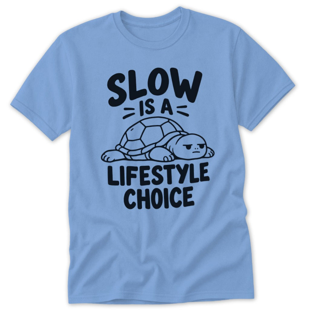 Light blue crewneck t-shirt featuring a resting turtle graphic and black text that reads Slow Is A Lifestyle Choice.